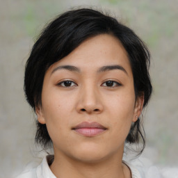 Neutral asian young-adult female with medium  brown hair and brown eyes