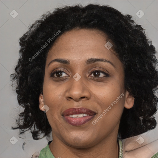 Joyful black adult female with medium  black hair and brown eyes