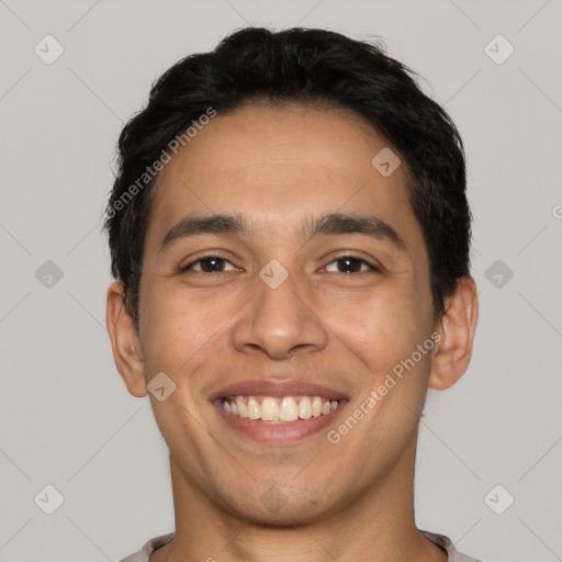 Joyful latino young-adult male with short  black hair and brown eyes