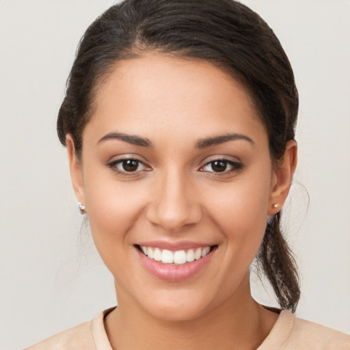 Joyful white young-adult female with medium  brown hair and brown eyes