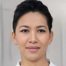 Joyful asian young-adult female with short  brown hair and brown eyes