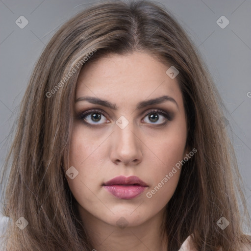 Neutral white young-adult female with long  brown hair and brown eyes