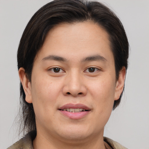 Joyful white young-adult male with medium  brown hair and brown eyes