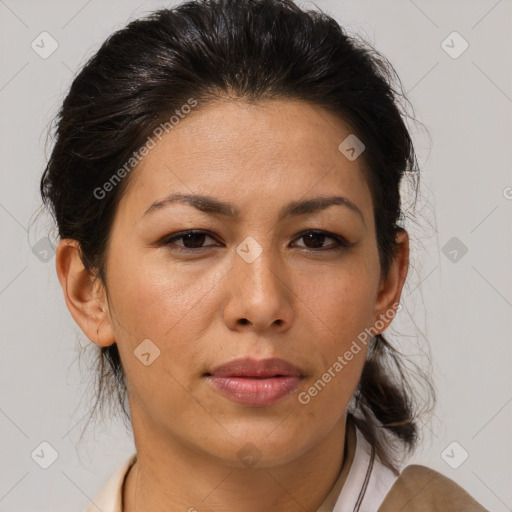 Joyful latino adult female with medium  brown hair and brown eyes