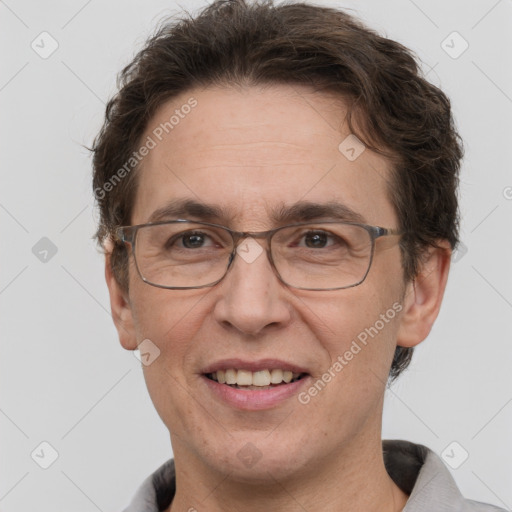 Joyful white adult male with short  brown hair and grey eyes