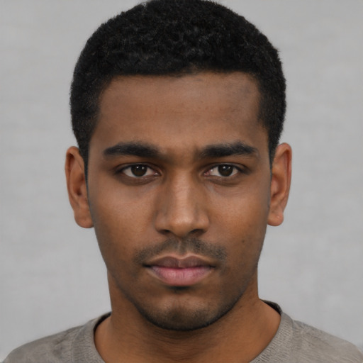 Neutral black young-adult male with short  black hair and brown eyes