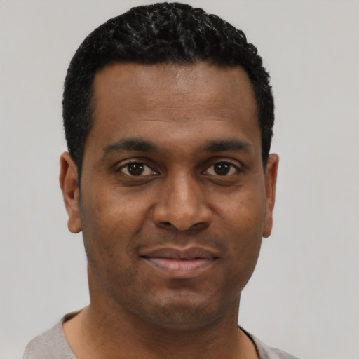 Neutral black young-adult male with short  black hair and brown eyes