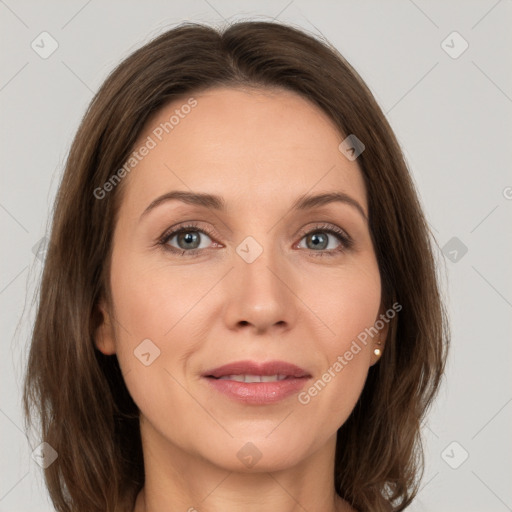 Joyful white adult female with long  brown hair and grey eyes