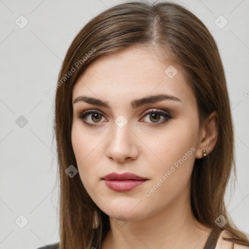 Neutral white young-adult female with long  brown hair and brown eyes