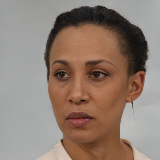 Neutral latino adult female with short  brown hair and brown eyes