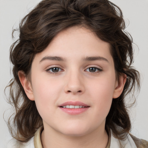 Joyful white child female with medium  brown hair and brown eyes