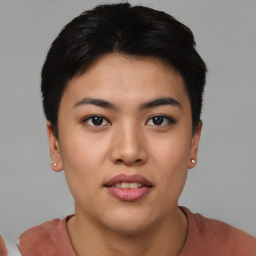 Joyful asian young-adult female with short  black hair and brown eyes