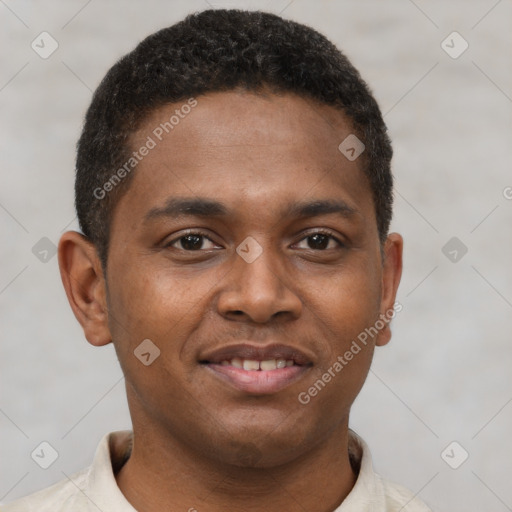 Joyful black young-adult male with short  brown hair and brown eyes