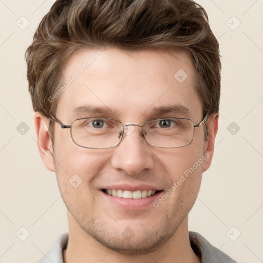 Joyful white adult male with short  brown hair and grey eyes