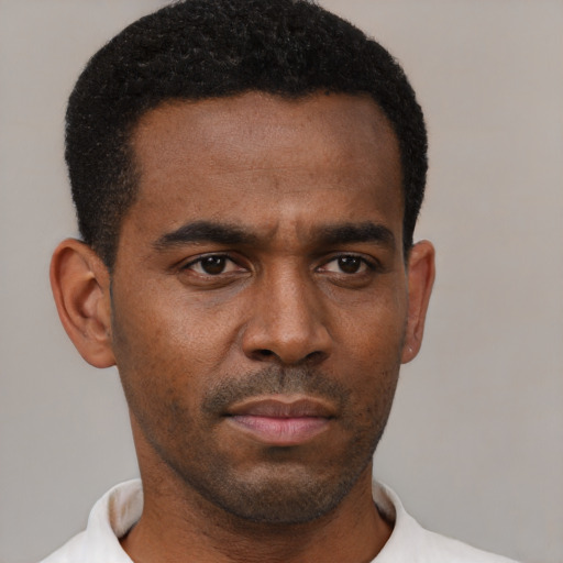 Neutral black young-adult male with short  black hair and brown eyes