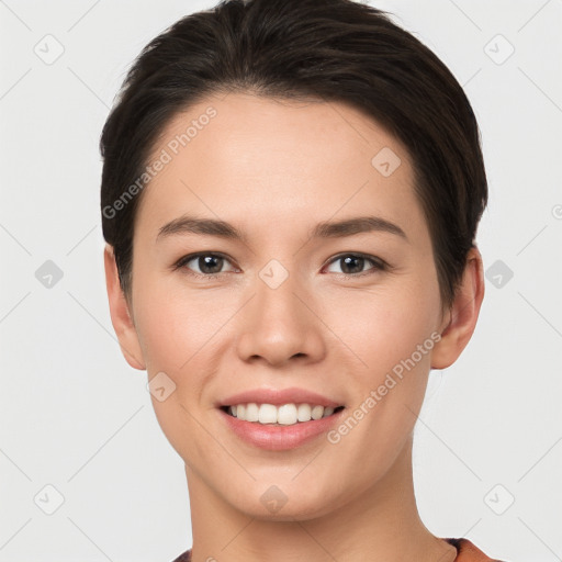 Joyful white young-adult female with short  brown hair and brown eyes