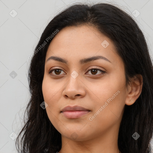 Joyful latino young-adult female with long  brown hair and brown eyes