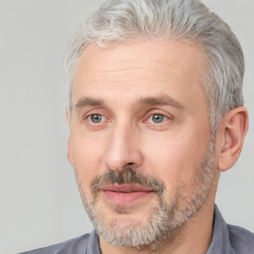 Neutral white middle-aged male with short  gray hair and brown eyes