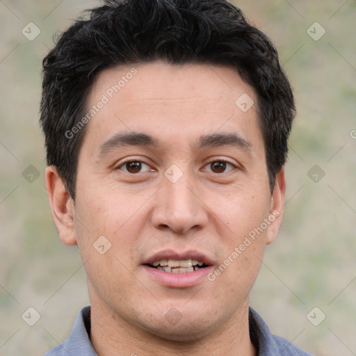 Joyful white young-adult male with short  black hair and brown eyes