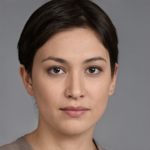 Joyful white young-adult female with medium  brown hair and brown eyes