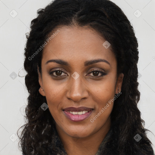 Joyful black young-adult female with long  brown hair and brown eyes