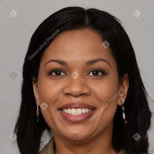 Joyful black young-adult female with long  brown hair and brown eyes