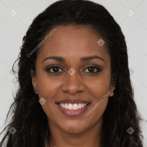 Joyful black young-adult female with long  brown hair and brown eyes