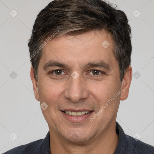 Joyful white adult male with short  brown hair and brown eyes