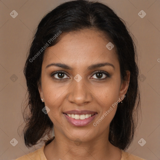 Joyful black young-adult female with medium  brown hair and brown eyes