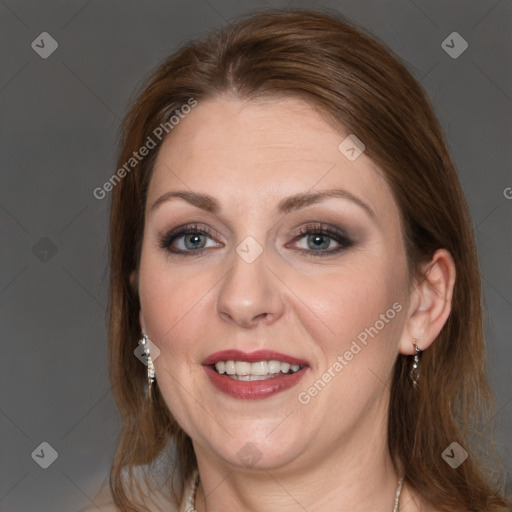 Joyful white adult female with medium  brown hair and grey eyes