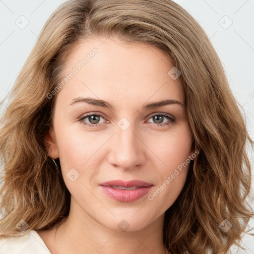 Joyful white young-adult female with long  brown hair and green eyes