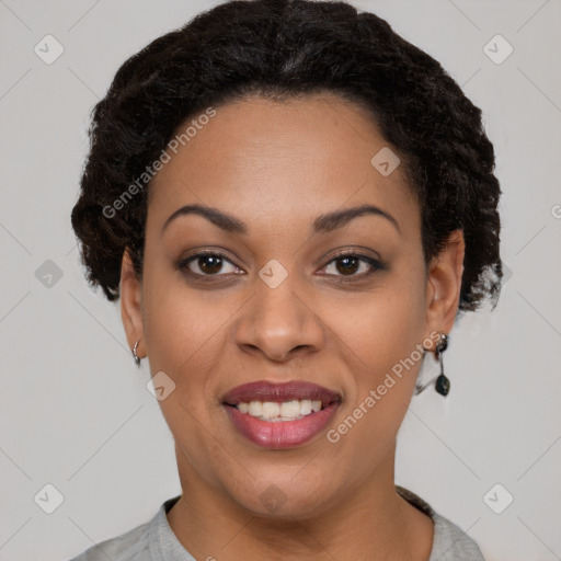 Joyful black young-adult female with short  black hair and brown eyes