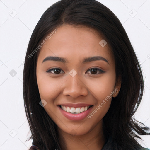 Joyful latino young-adult female with long  brown hair and brown eyes