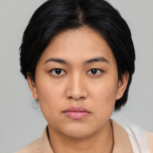 Neutral asian young-adult female with medium  black hair and brown eyes