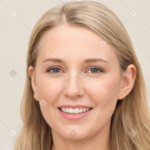 Joyful white young-adult female with long  brown hair and blue eyes