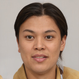 Joyful asian young-adult female with short  brown hair and brown eyes