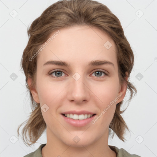 Joyful white young-adult female with medium  brown hair and grey eyes