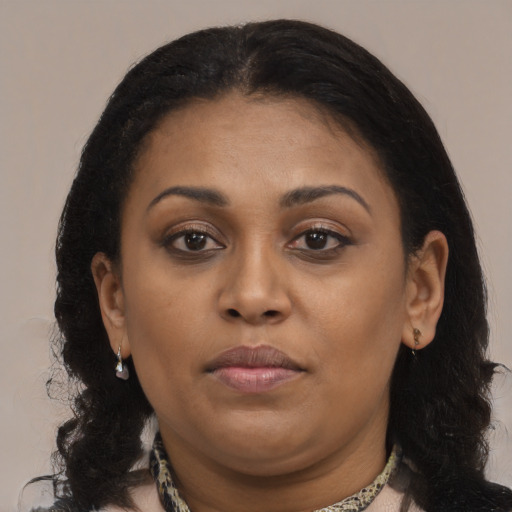 Joyful black young-adult female with medium  brown hair and brown eyes