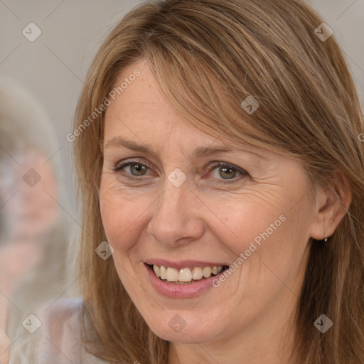 Joyful white adult female with long  brown hair and brown eyes