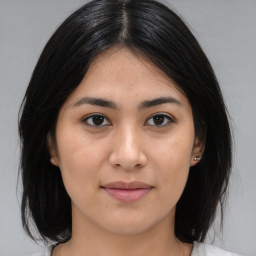 Joyful asian young-adult female with medium  brown hair and brown eyes