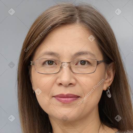 Joyful white adult female with long  brown hair and grey eyes