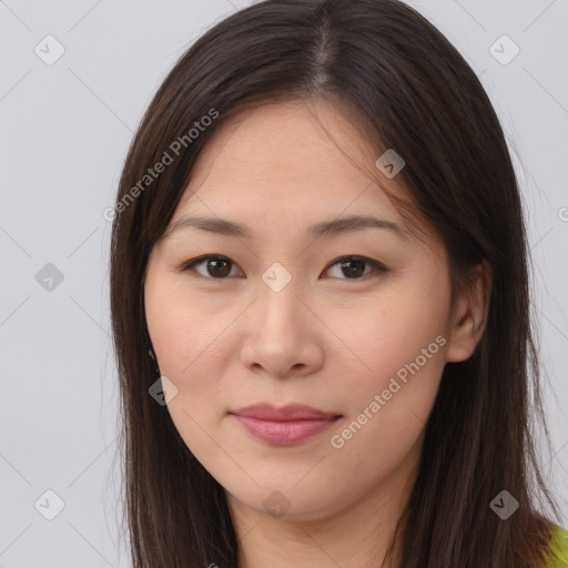 Joyful asian young-adult female with long  brown hair and brown eyes