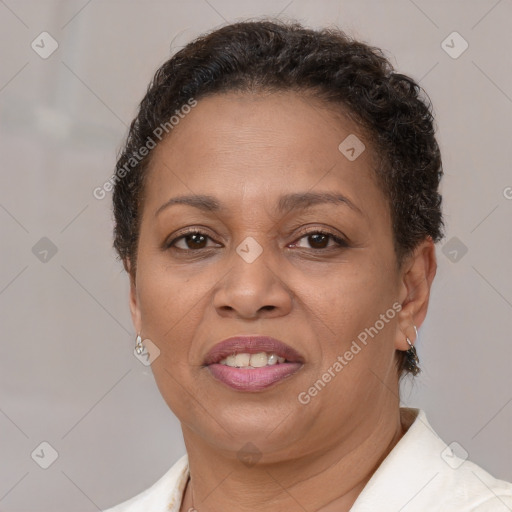 Joyful latino adult female with short  brown hair and brown eyes