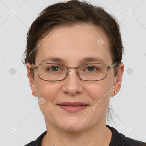 Joyful white adult female with short  brown hair and grey eyes