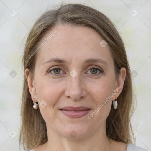 Joyful white adult female with medium  brown hair and grey eyes