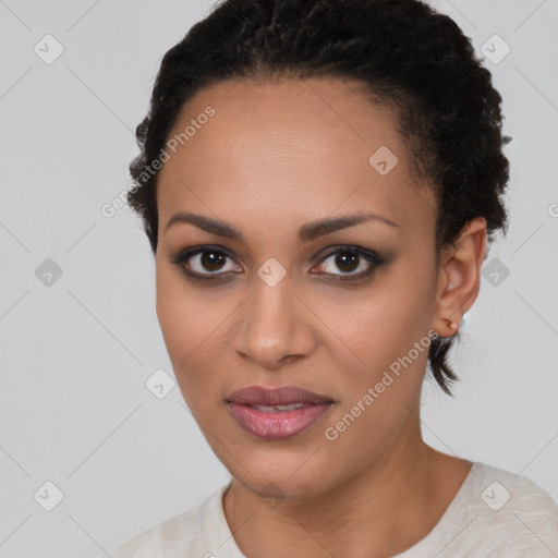 Joyful black young-adult female with short  brown hair and brown eyes