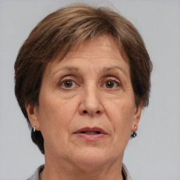 Joyful white middle-aged female with short  brown hair and brown eyes