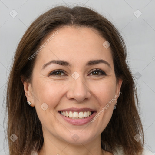 Joyful white adult female with medium  brown hair and brown eyes