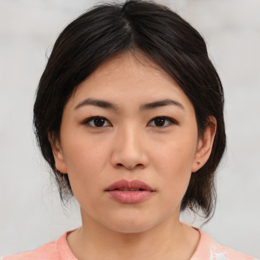 Neutral asian young-adult female with medium  black hair and brown eyes