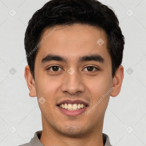 Joyful latino young-adult male with short  brown hair and brown eyes